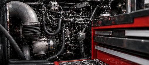 Diesel truck engine bay with technician tools